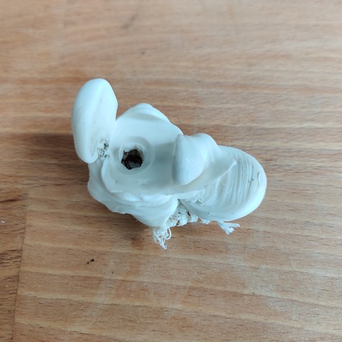 Hotend blob in white material. The blob shows the shape of the hotend as a negative. 