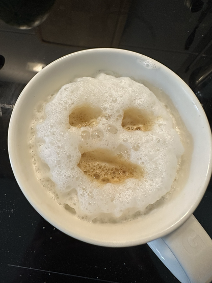 Face on a coffee